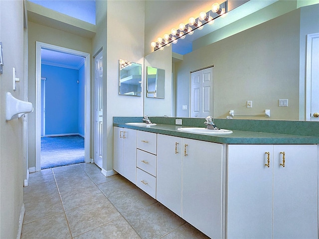 bathroom with tile patterned floors and vanity