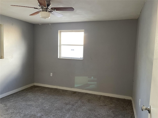 spare room with ceiling fan and carpet flooring