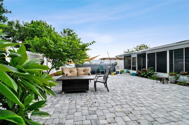 view of patio featuring a sunroom and an outdoor hangout area