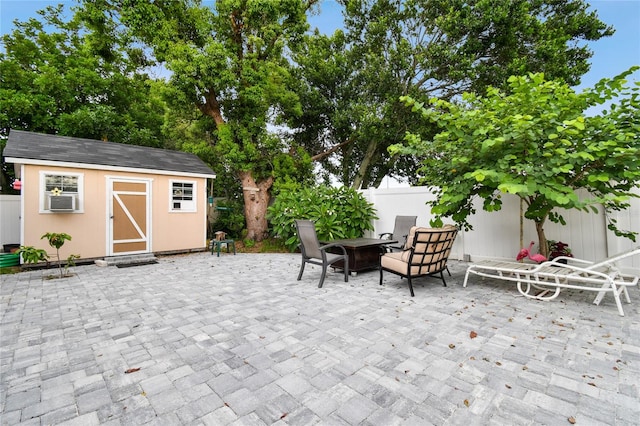 view of patio featuring a storage unit