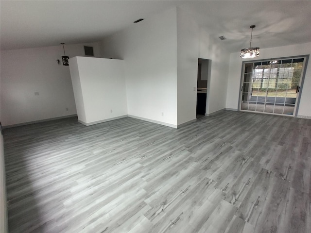 interior space with high vaulted ceiling and light hardwood / wood-style floors