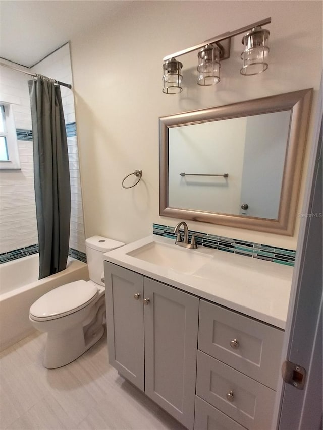 full bathroom with vanity, toilet, and shower / tub combo