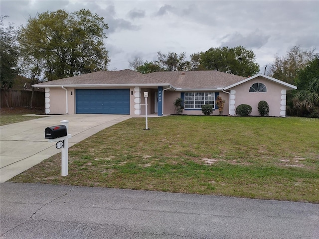 ranch-style home with a garage and a front lawn