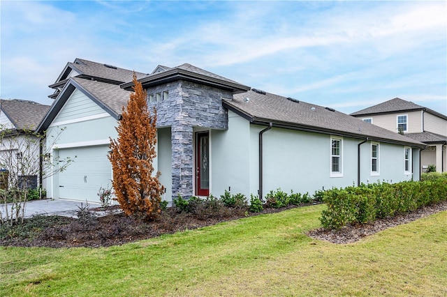 view of side of property featuring a garage and a lawn