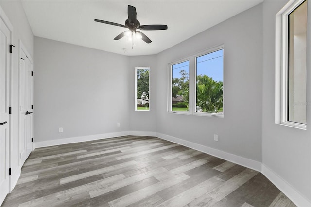 unfurnished bedroom featuring hardwood / wood-style floors and ceiling fan