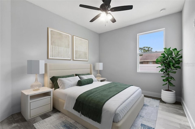 bedroom featuring ceiling fan and light hardwood / wood-style flooring