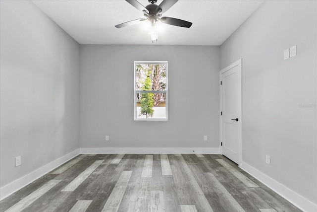 spare room featuring ceiling fan and hardwood / wood-style floors