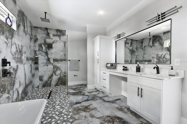 bathroom with vanity, separate shower and tub, and a textured ceiling