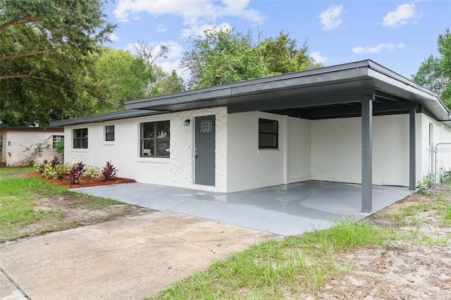 view of front of house with a carport