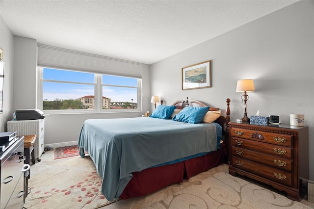 bedroom featuring a textured ceiling