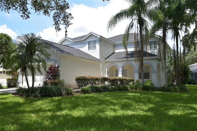 5308 Cedarshake Ln, Valrico, FL 33596 - view of front of house with stucco siding, roof with shingles, and a front yard