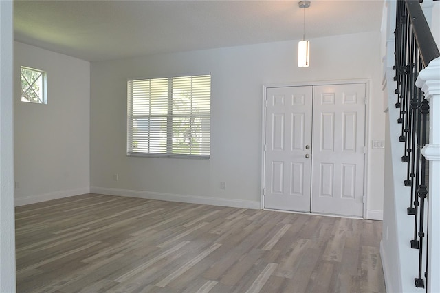 foyer entrance with hardwood / wood-style flooring