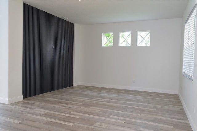 spare room with light hardwood / wood-style flooring