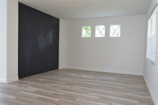 5308 Cedarshake Ln, Valrico, FL 33596 - spare room featuring baseboards, light wood-style flooring, and plenty of natural light
