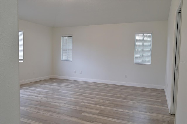 spare room with light hardwood / wood-style floors