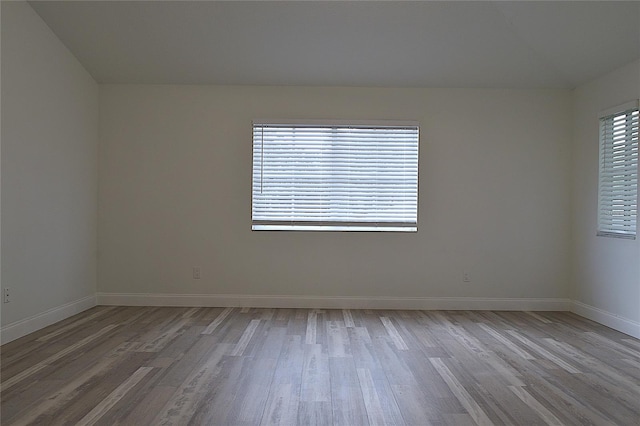 empty room with wood-type flooring