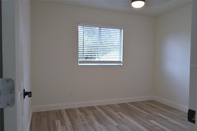 spare room featuring hardwood / wood-style flooring