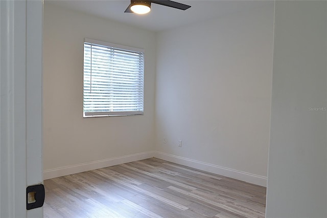 empty room with light wood-type flooring and ceiling fan