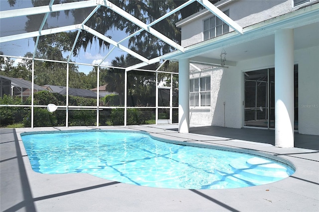 view of pool featuring a patio area and a lanai