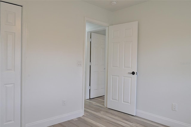 5308 Cedarshake Ln, Valrico, FL 33596 - unfurnished bedroom with light wood-style floors and baseboards
