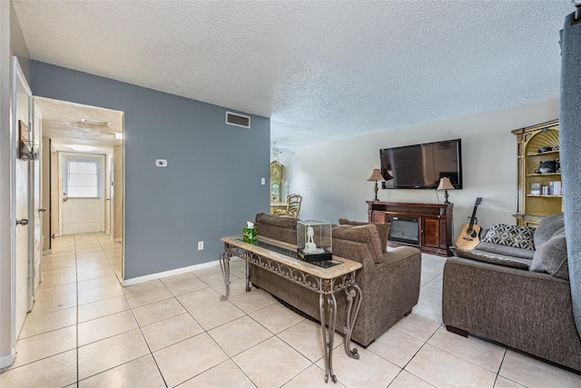 tiled living room with a textured ceiling