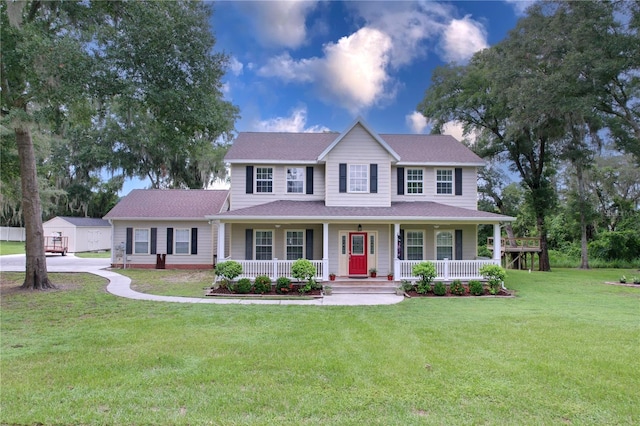 view of front of home featuring covered porch and a front lawn