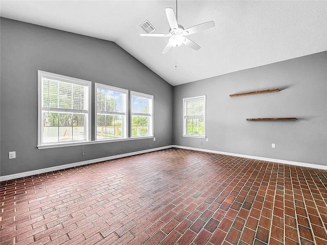 spare room with lofted ceiling and ceiling fan