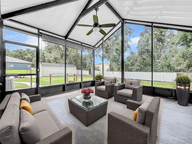 sunroom featuring lofted ceiling and ceiling fan