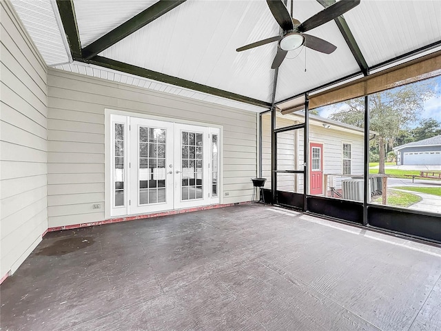 unfurnished sunroom featuring vaulted ceiling, french doors, and ceiling fan