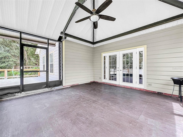 unfurnished sunroom with ceiling fan and french doors