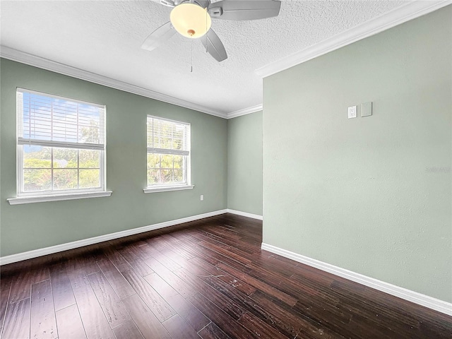 spare room with ornamental molding, dark wood-type flooring, a textured ceiling, and ceiling fan