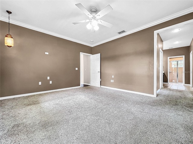 spare room featuring ornamental molding and ceiling fan