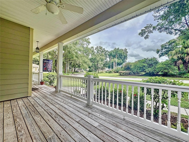 wooden deck featuring ceiling fan