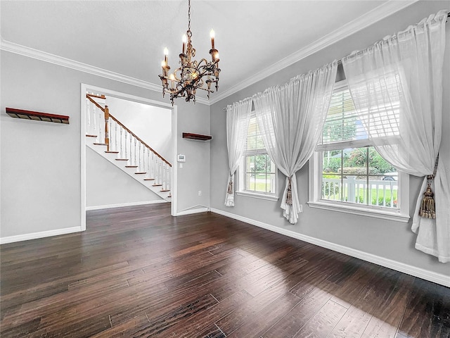 interior space featuring a notable chandelier, ornamental molding, and dark hardwood / wood-style floors