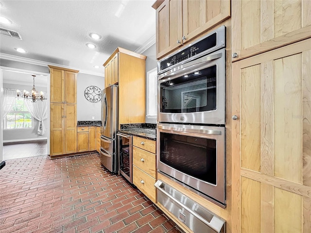 kitchen featuring crown molding, a chandelier, light brown cabinets, appliances with stainless steel finishes, and beverage cooler