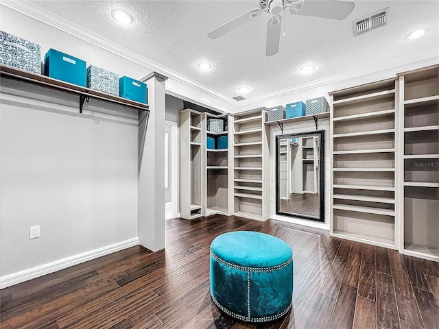 spacious closet with hardwood / wood-style flooring and ceiling fan