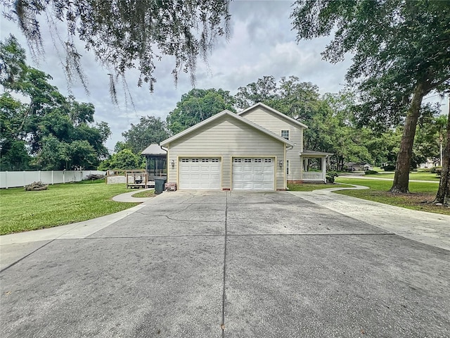 view of home's exterior featuring a garage and a lawn