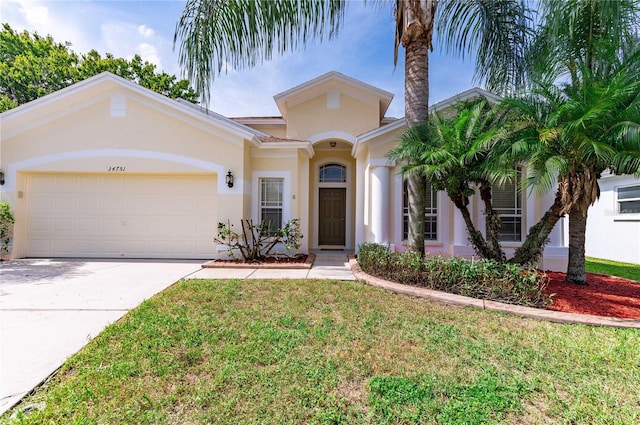 view of front of home with a garage and a front lawn