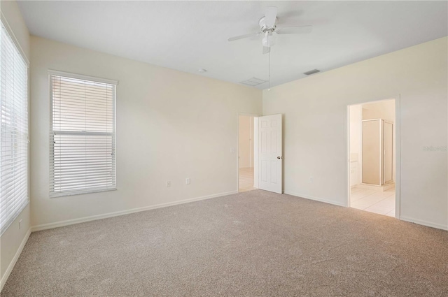 spare room with light carpet and ceiling fan