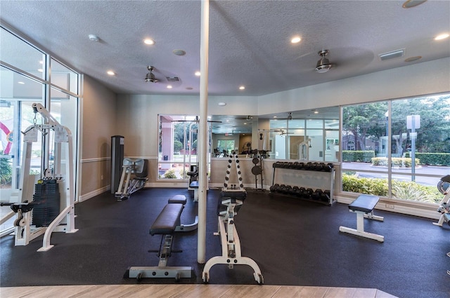 gym featuring a textured ceiling