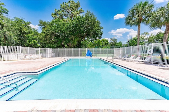 view of swimming pool featuring a patio area