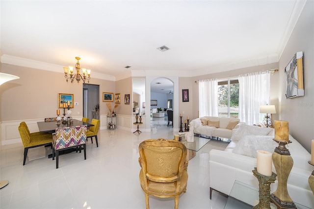 living room featuring crown molding, light tile patterned flooring, and a notable chandelier