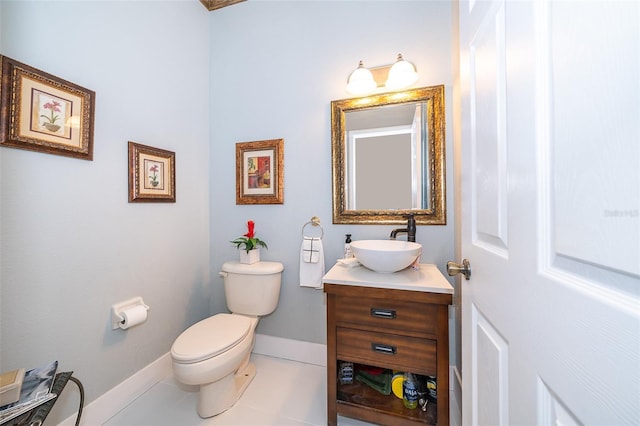 bathroom with vanity, tile patterned floors, and toilet