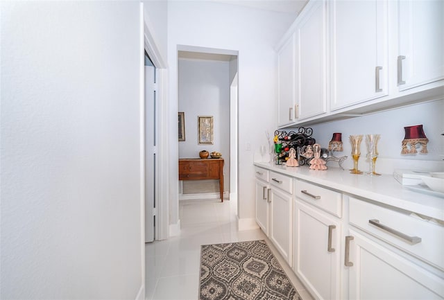 hallway with light tile patterned flooring