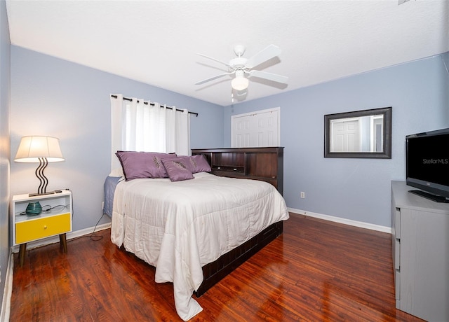 bedroom featuring dark hardwood / wood-style flooring and ceiling fan