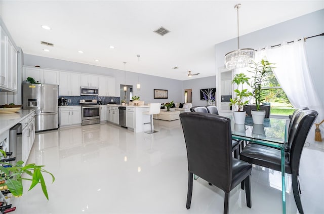 dining area featuring an inviting chandelier