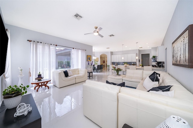 living room featuring ceiling fan