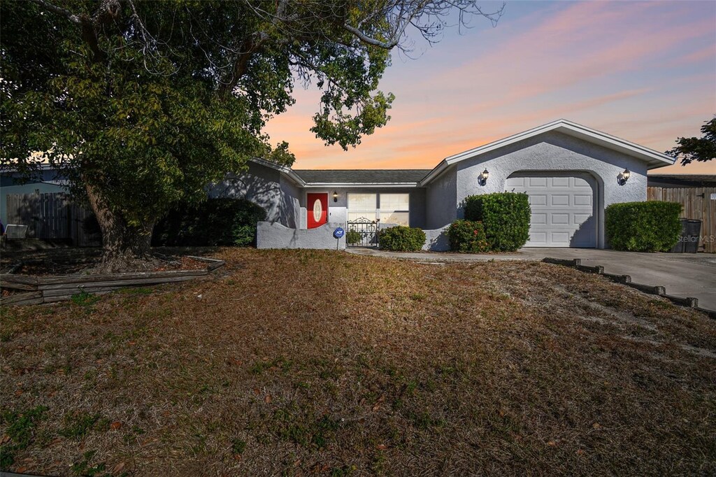 ranch-style home with a garage