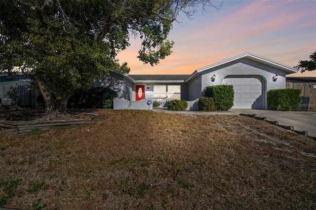 ranch-style home with a garage