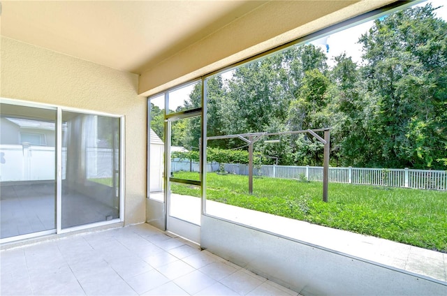 unfurnished sunroom featuring a healthy amount of sunlight